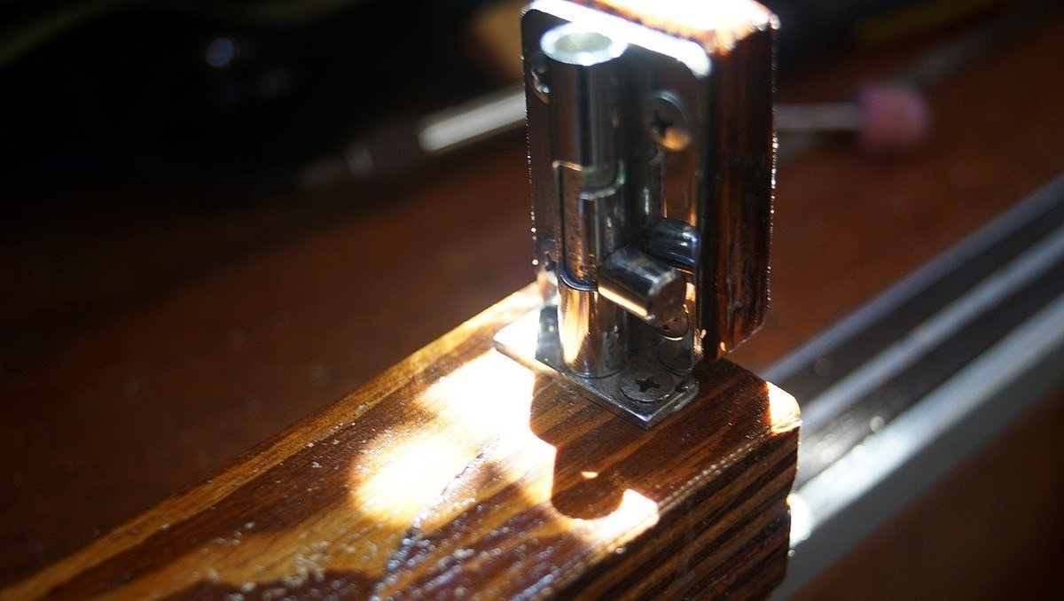 Photo of the bolt locks that we installed in dry toilet lid