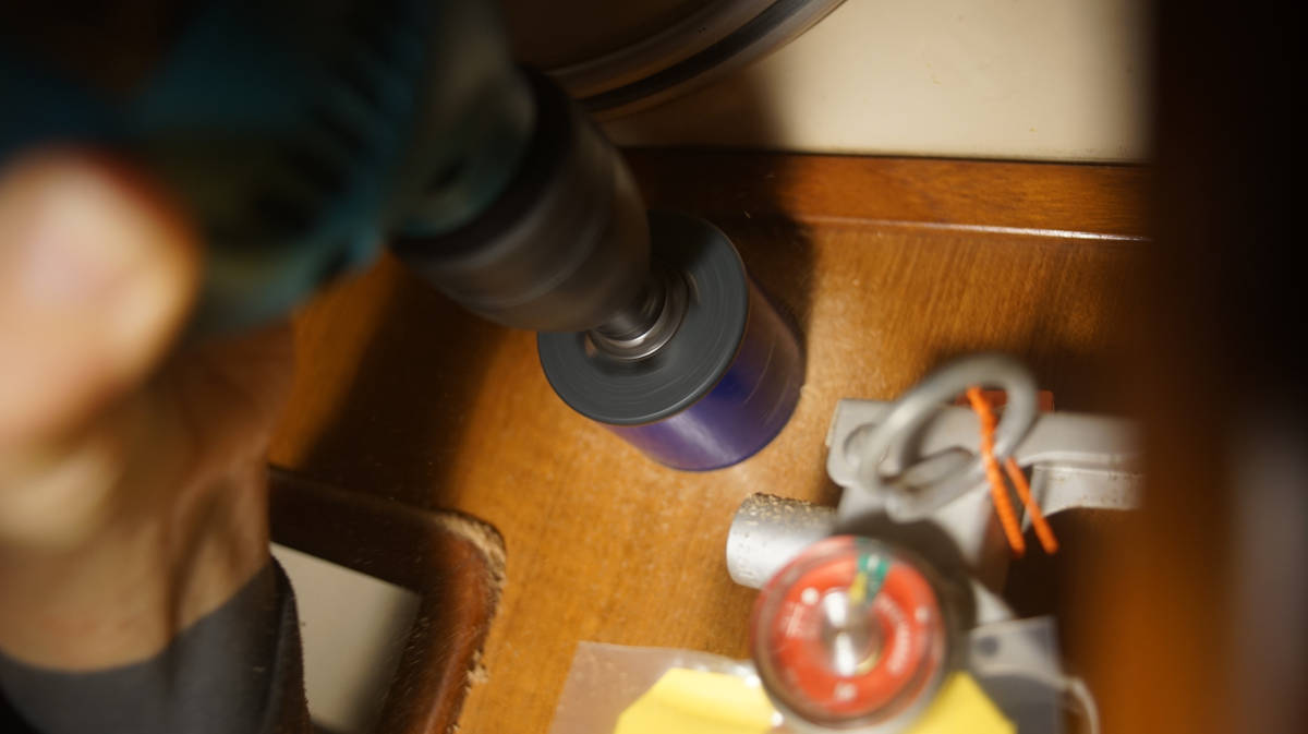 making a hole for the gauge in the wall with a hole saw