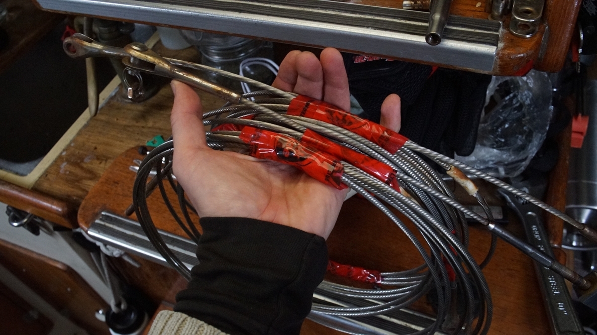 a stainless steel lower lifeline wrapped in a coil, showing corrosion