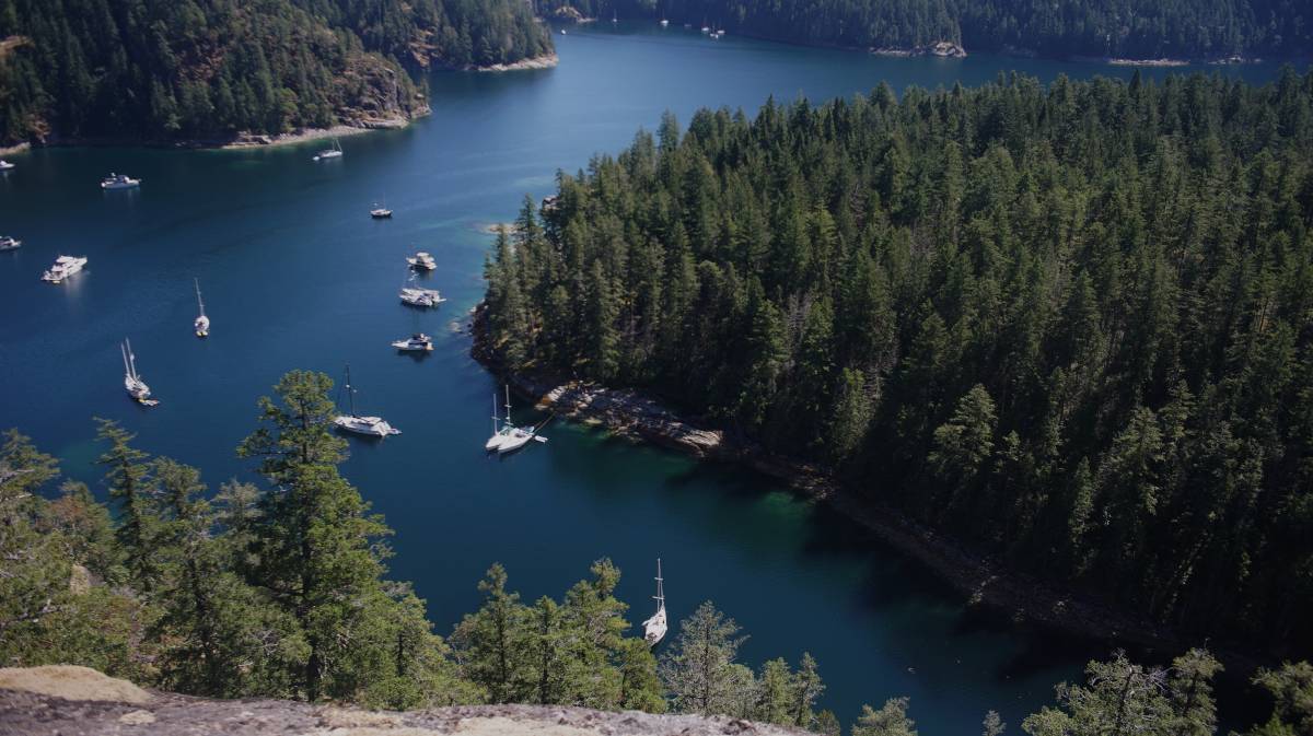 tenedos bay from the cliff lookout, with pino anchored in the bay below