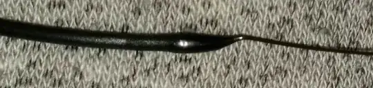 Photo of filament with a blob of filament a the end after being pulled from the hotend