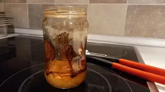 Glass jar with burnt melted plastic Glass jar with burnt melted plastic