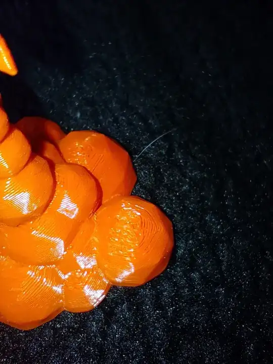 Photo of a 3D printed model with printing errors on the top Photo of a 3D printed model with printing errors on the top