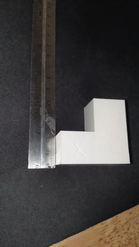 3D printed calibration model with ruler next beside it to show the irregularity