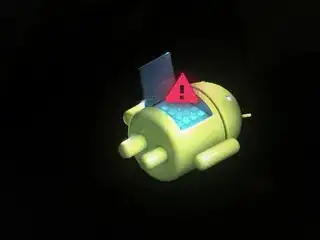 Pictured: the Android robot on its back, with an exclamation mark inside a red triangle.