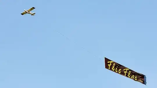Photo of banner being towed by aircraft