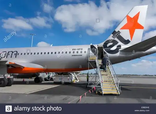 Passenger boarding rear of aircraft