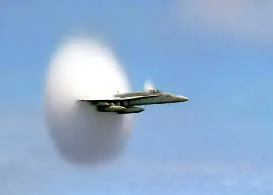 FA-18 with condensation shockwaves