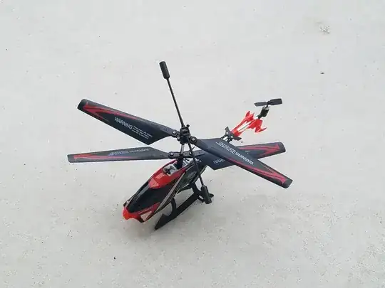 An RC helicopter with two coaxial main rotors, a balance bar, and a tailrotor to produce vertical thrust.