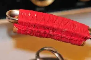 metal handle with cork and string