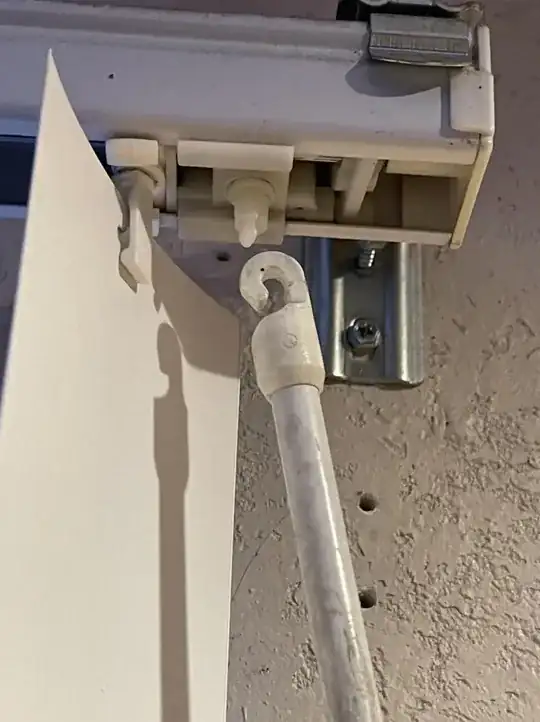 broken curtain rod piece with rod zoomed