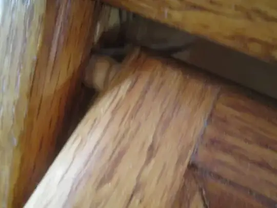 Detail of the door with wooden pin into the groove in the side wall.