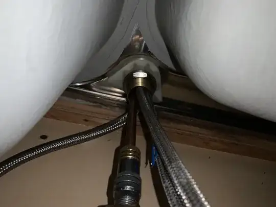 a difficult to reach nut under sink