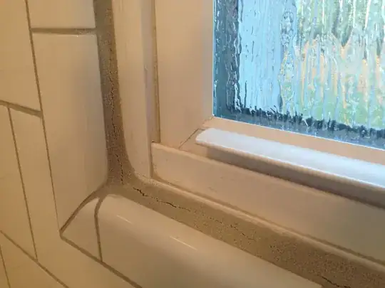 More cracked grout around the window in my shower