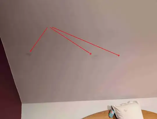 Damp spots on painted ceiling