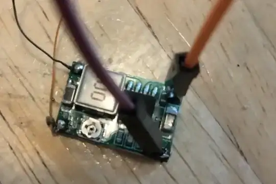 step down pcb with orange wire to +IN, purple wire to -IN, and webcam black and orange wire to +OUT and -OUT respectively