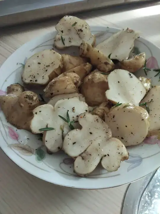 Oiled and flavored sunchokes before baking