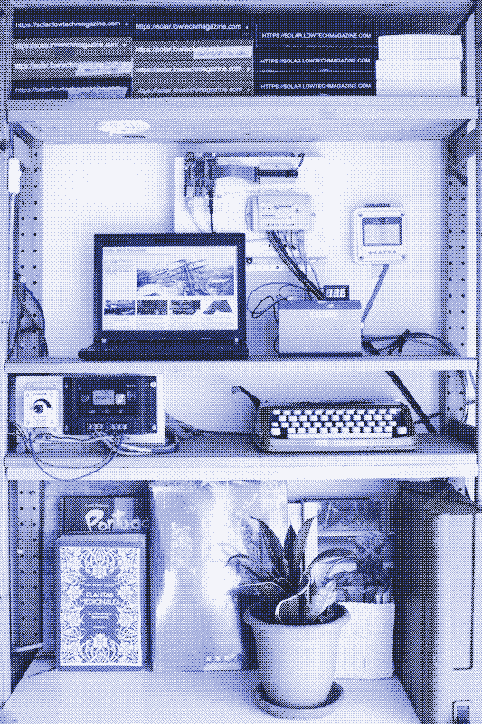 The solar powered server in its new housing, screwed against the wall in the living room. The battery is in front. The solar charge controller below the laptop powers the lights in the room. Image by Marie Verdeil.