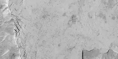 Close-up of blocks being formed, as seen by HiRISE under HiWish program.  Many long fractures are visible on the surface.