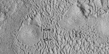 Brain terrain being formed, as seen by HiRISE under HiWish program. Note: this is an enlargement of a previous image using HiView.  Arrows indicate spots where brain terrain is beginning to form.