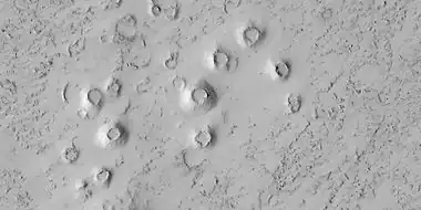 Close view of cones, as seen by HiRISE under HiWish program. These cones probably formed when hot lava flowed over ice-rich ground.  The location is the Elysium quadrangle.
