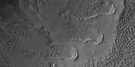 Close view of gully from a previous image, as seen by HiRISE under HiWish program. Curved ridges may have formed by glaciers before the gullies were created.