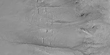 Close view of gully channels, as seen by HiRISE under HiWish program. Channels make some tight curves.