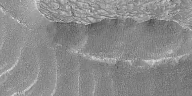 Close view of snout of flow, as seen by HiRISE under HiWish program.  Polygonal patterned ground is visible.