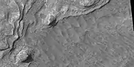 Close view of layers, as seen by HiRISE under HiWish program. Boulders are also visible in the image.