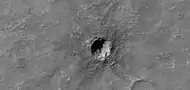 Small crater, as seen by HiRISE under HiWish program.  Much of the ejecta consists of boulders.