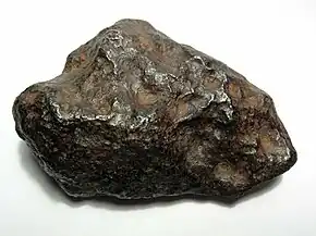 A 700-gram (25&nbsp;oz) individual Chinga iron meteorite (Ataxite, class IVB). This specimen is about 9 centimeters wide.