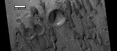 Dunes among craters, as seen by HiRISE under HiWish program.  Some of these dunes are barchans.  Research published in Icarus stated that the dunes in Hershel Crater moved  0.8 m in a time span of 3.7 Earth-years. Also, it was determined that dune ripple moved 1.1 m in that time period.  Other dunes may exhibit a similar amount of movement.