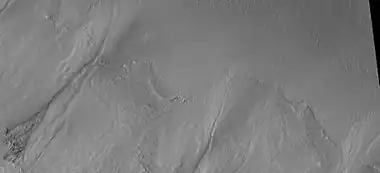 Close-up of gully aprons showing they are free of craters, hence very young.  Location is Phaethontis quadrangle.  Picture was taken by HiRISE under HiWish program.