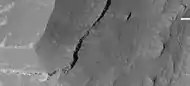 Enlargement of edge of mesa on floor of Noctis Labyrinthus showing layers, as seen by HiRISE under HiWish program.  Note: this is an enlargement of a previous image.