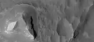 Light-toned butte on floor of Noctis Labyrinthus, as seen by HiRISE under HiWish program.  Note: this is an enlargement of a previous image.