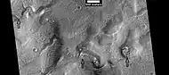 Layered features in channels and depressions, as seen by HiRISE under HiWish program. Arrows point to some of the layered features.