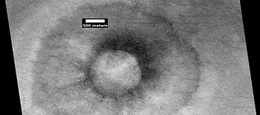 Pedestal crater with boulders along rim.  Such craters are called "halo craters".  Picture taken with HiRISE under HiWish program.