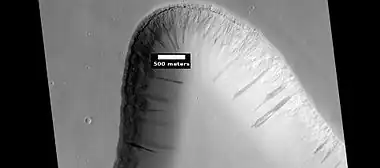 Layers in trough and dark slope streaks, as seen by HiRISE under HiWish program. Location is Amazonis quadrangle.