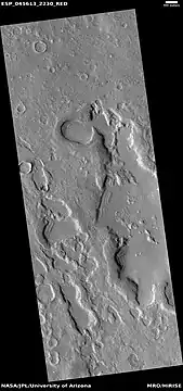 Wide view of dipping layers along mesa walls, as seen by HiRISE under HiWish program