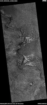 Light-toned material, as seen by HiRISE under HiWish program.  Light-toned material is often associated with minerals that formed in water.