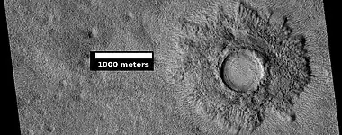 Pedestal crater, as seen by HiRISE under HiWish program.  The crater's ejecta protected the underlying ground from eroding.