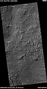 Channel, as seen by HiRISE under HiWish program.  Arrows indicate position of channel in this rather dark photo.