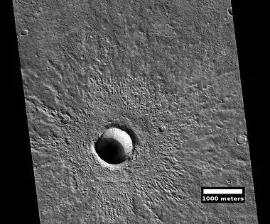 Fresh crater, as seen by HiRISE under HiWish program.  This is a young crater because one can easily see the rim and ejecta.  They have not yet been eroded.