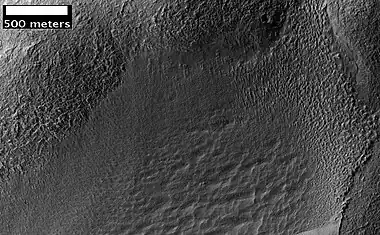 Possible Glacial Cirque in Hellas Planitia, as seen by HiRISE, under the HiWish program.  Lines are probably due to downhill movement.