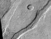 Icaria Fossae Graben, as seen by HiRISE.  Click on image for a better view of Dust Devil Tracks.