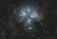 A widefield view of the Pleiades showing the surrounding dust.  Image taken with 7 hours of total exposure time.