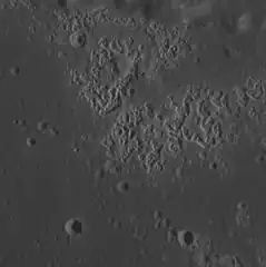 Hollows in Zeami crater.  Image width is about 23.2 km.