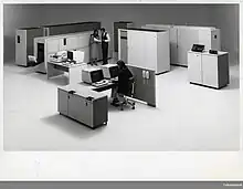 The IBM 3800 is directly behind the couple standing in the photo