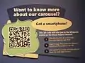 A label in The Children's Museum of Indianapolis that uses a QRpedia code to direct visitors to the Wikipedia article "Broad Ripple Park Carousel"
