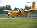 Vortices form at the ends of propeller blades, as seen on this DHC-5 Buffalo.